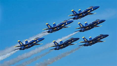 Four U.S. Navy Blue Angels jets flying in tight diamond formation over Fort Lauderdale Beach during the 2025 Air Dot Show.